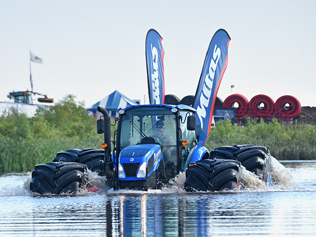 Mitas Tires outfitted a New Holland tractor with some of its largest tires to prove flotation potential, Image by Joel Reichenberger